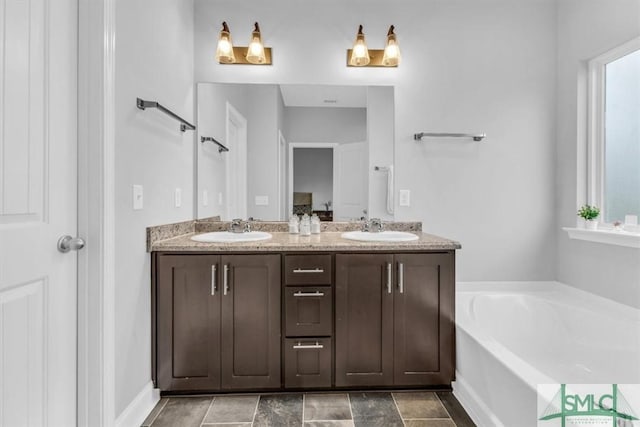 bathroom featuring vanity and a bathing tub