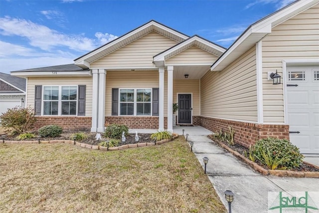 view of front of house with a garage and a front yard