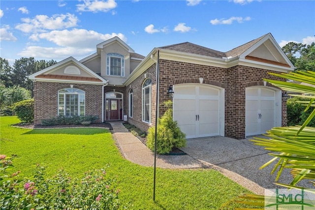 view of front of home featuring a front yard and a garage