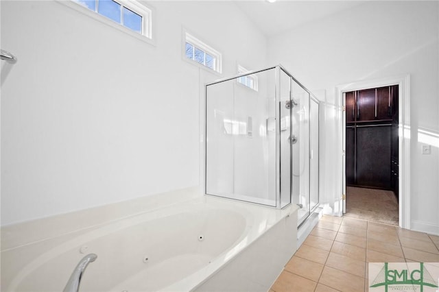 bathroom with plus walk in shower and tile patterned flooring