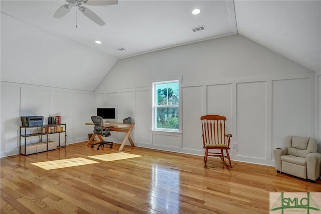 office featuring ceiling fan, lofted ceiling, and light hardwood / wood-style flooring