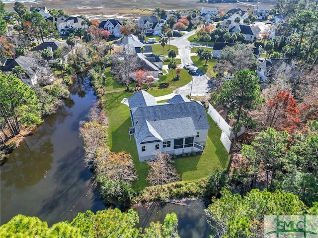 bird's eye view with a water view