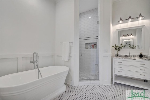 bathroom featuring vanity and separate shower and tub