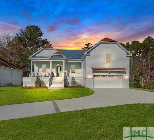 craftsman inspired home featuring a porch, a garage, and a lawn