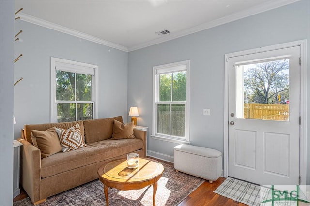 living room featuring hardwood / wood-style floors and ornamental molding