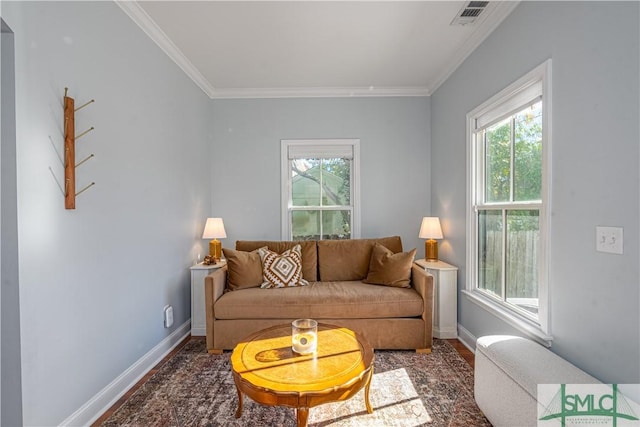 living room with dark wood-type flooring and ornamental molding