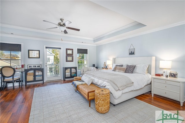 bedroom featuring access to exterior, ornamental molding, a tray ceiling, ceiling fan, and light hardwood / wood-style floors