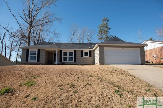 single story home featuring a garage