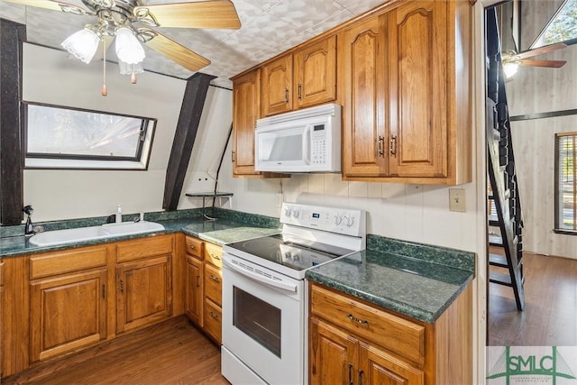 kitchen with ceiling fan, sink, hardwood / wood-style floors, and white appliances