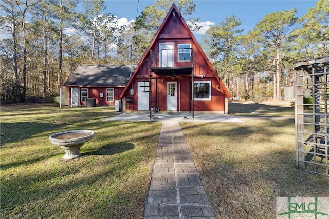 english style home with a front yard