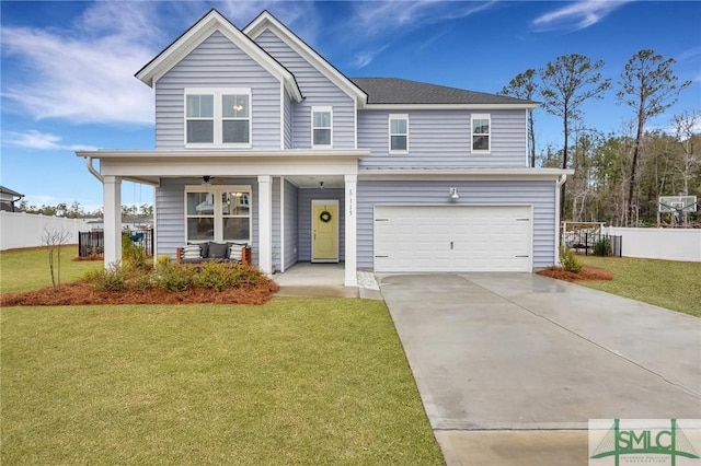 view of front facade with a porch, a front yard, and a garage