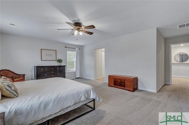 bedroom with ceiling fan and light colored carpet