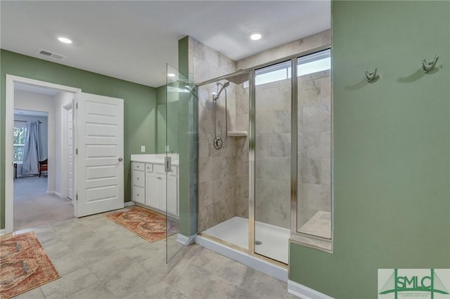 bathroom featuring vanity and walk in shower