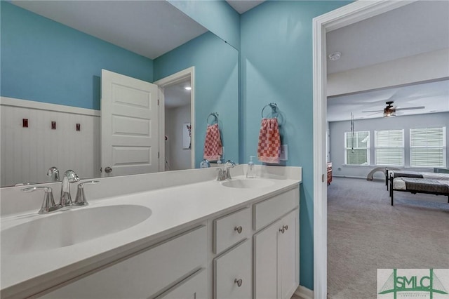 bathroom with ceiling fan and vanity