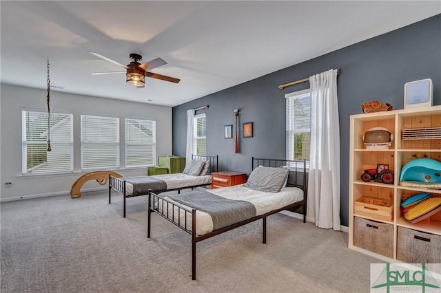 bedroom featuring light carpet and ceiling fan