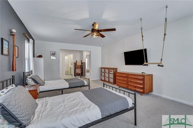 carpeted bedroom with connected bathroom and ceiling fan