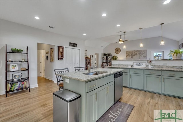 kitchen with dishwasher, a center island with sink, sink, ceiling fan, and decorative light fixtures