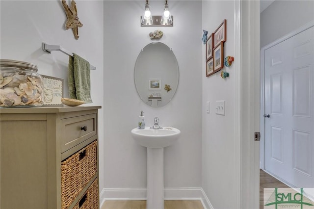 bathroom with hardwood / wood-style floors