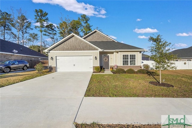 view of front of house featuring a front yard and a garage