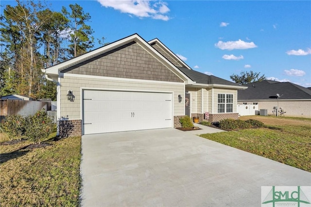 view of front of house featuring central AC unit, a garage, and a front lawn