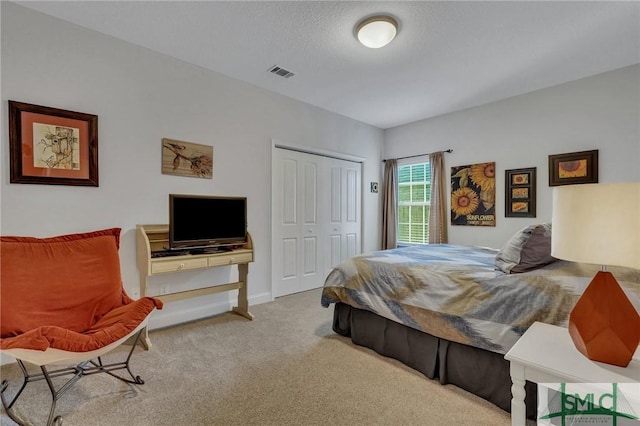 carpeted bedroom with a closet