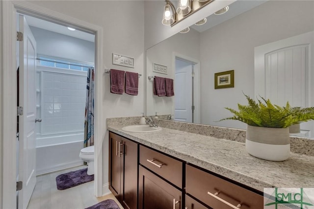 full bathroom featuring vanity, shower / tub combo, and toilet