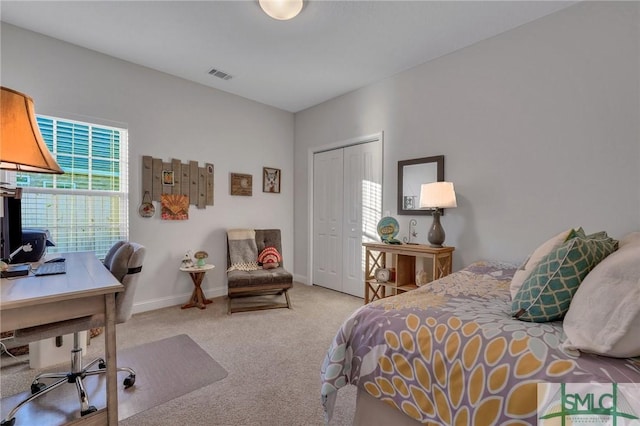 bedroom featuring carpet and a closet