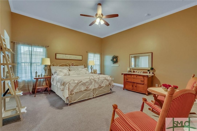 carpeted bedroom featuring multiple windows, ceiling fan, and ornamental molding