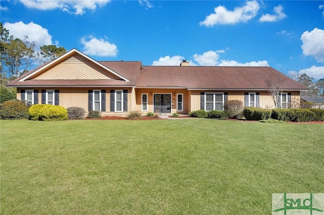 ranch-style home with a front lawn