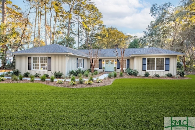 single story home with a front lawn