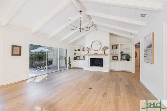 unfurnished living room with a fireplace, lofted ceiling with beams, built in features, and light wood-type flooring