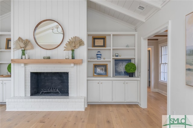 unfurnished living room featuring vaulted ceiling with beams, light hardwood / wood-style floors, wood ceiling, and a fireplace