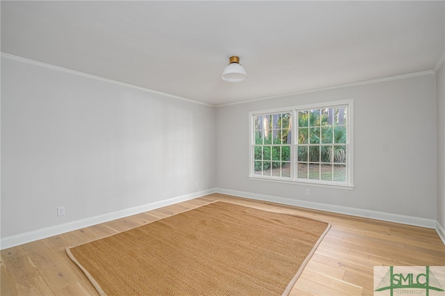 unfurnished room featuring crown molding and hardwood / wood-style flooring