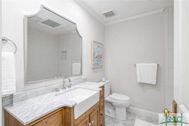 bathroom with vanity, toilet, and crown molding