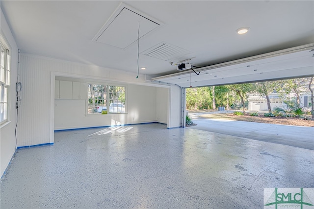 garage featuring a garage door opener