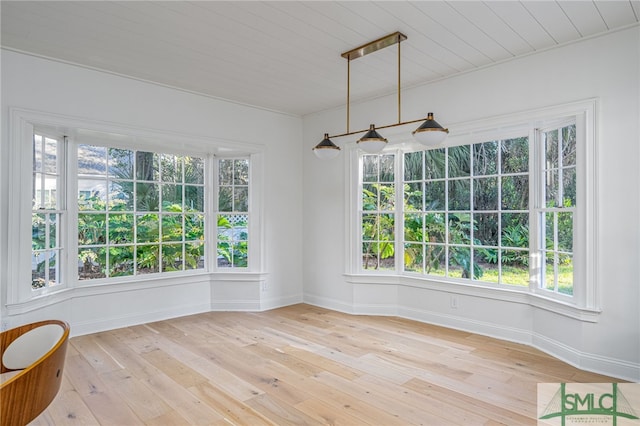 spare room featuring wood ceiling and light hardwood / wood-style floors