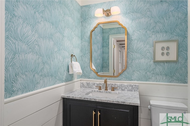 bathroom with vanity and toilet