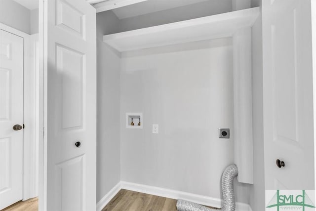 laundry area featuring electric dryer hookup, hardwood / wood-style floors, and washer hookup