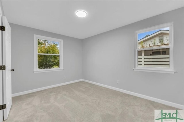 unfurnished bedroom featuring light carpet