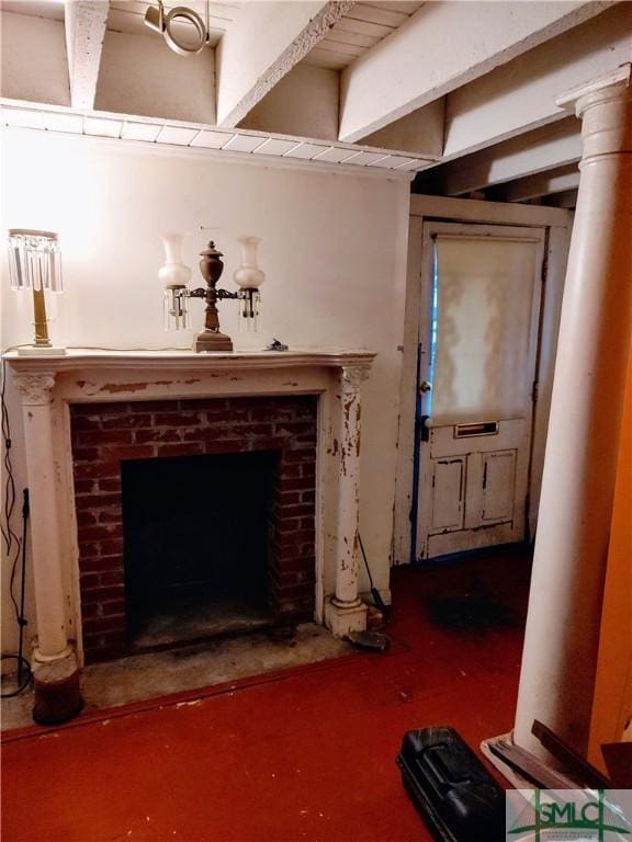 living room with a brick fireplace