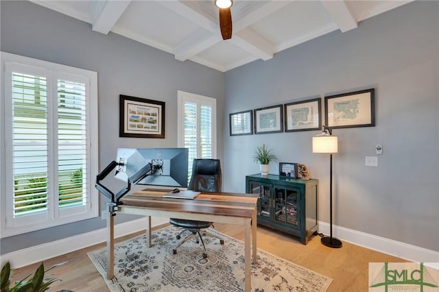 office space featuring light hardwood / wood-style flooring and beamed ceiling