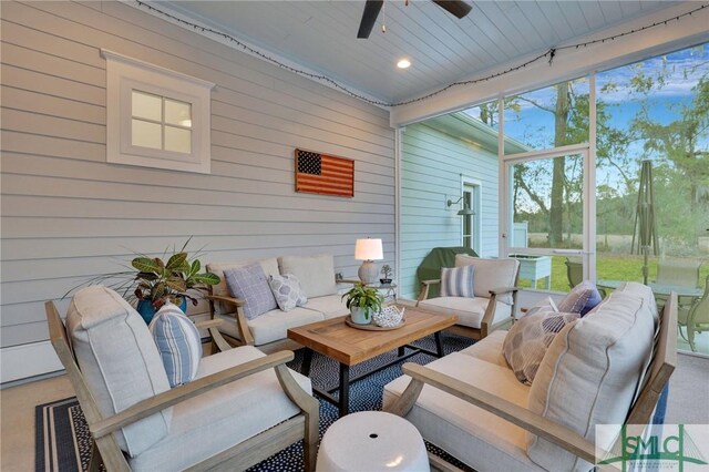 sunroom with ceiling fan