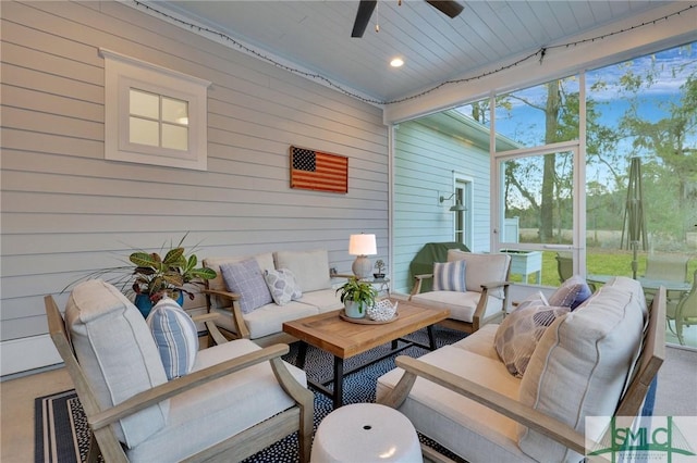 sunroom / solarium featuring ceiling fan and wood ceiling