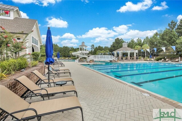 view of pool featuring a gazebo and a patio area