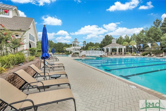 view of pool with a patio and a gazebo