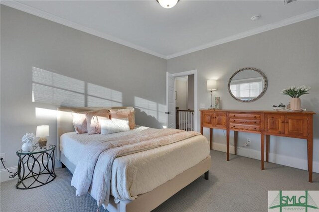 bedroom with carpet floors and ornamental molding