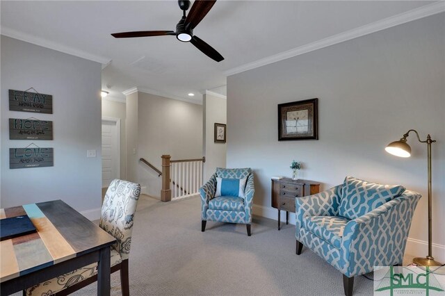 sitting room featuring ceiling fan, crown molding, and light carpet