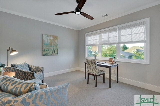 carpeted home office with ceiling fan and ornamental molding