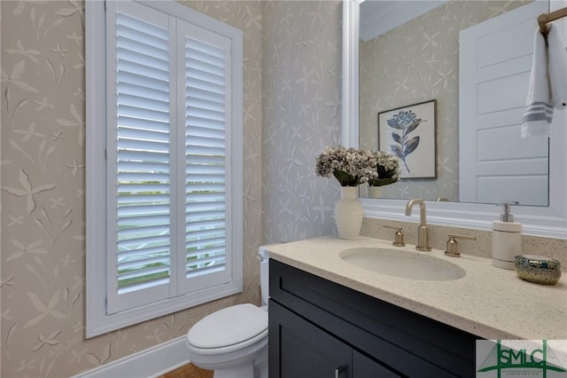 bathroom featuring vanity and toilet