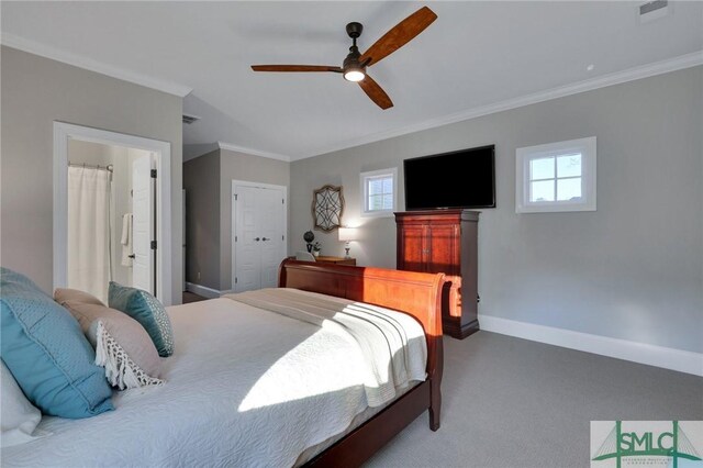 bedroom with ceiling fan, a closet, carpet, and crown molding